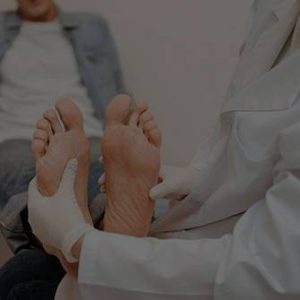 cropped image of neuropathic foot pain examined by a chiropractor
