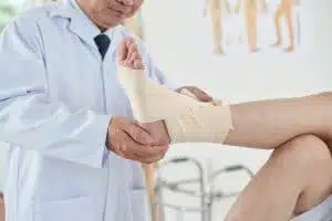 The Doctor checking the recurrent injury in leg at Houston, TX