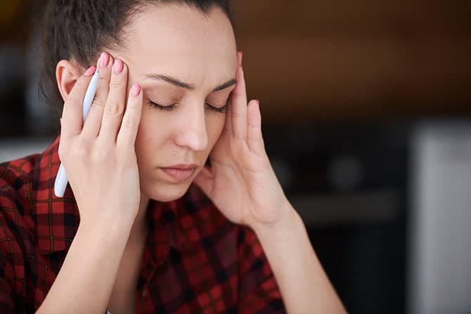 woman having a headache