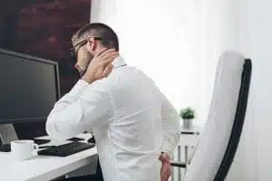 man suffers from back pain