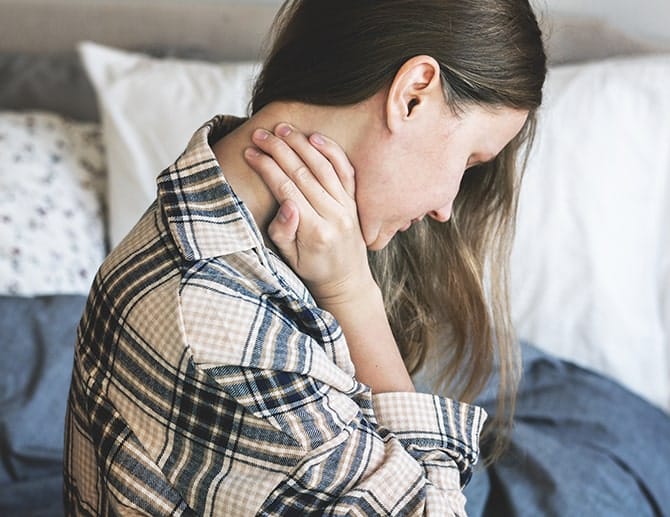 female having neck pain