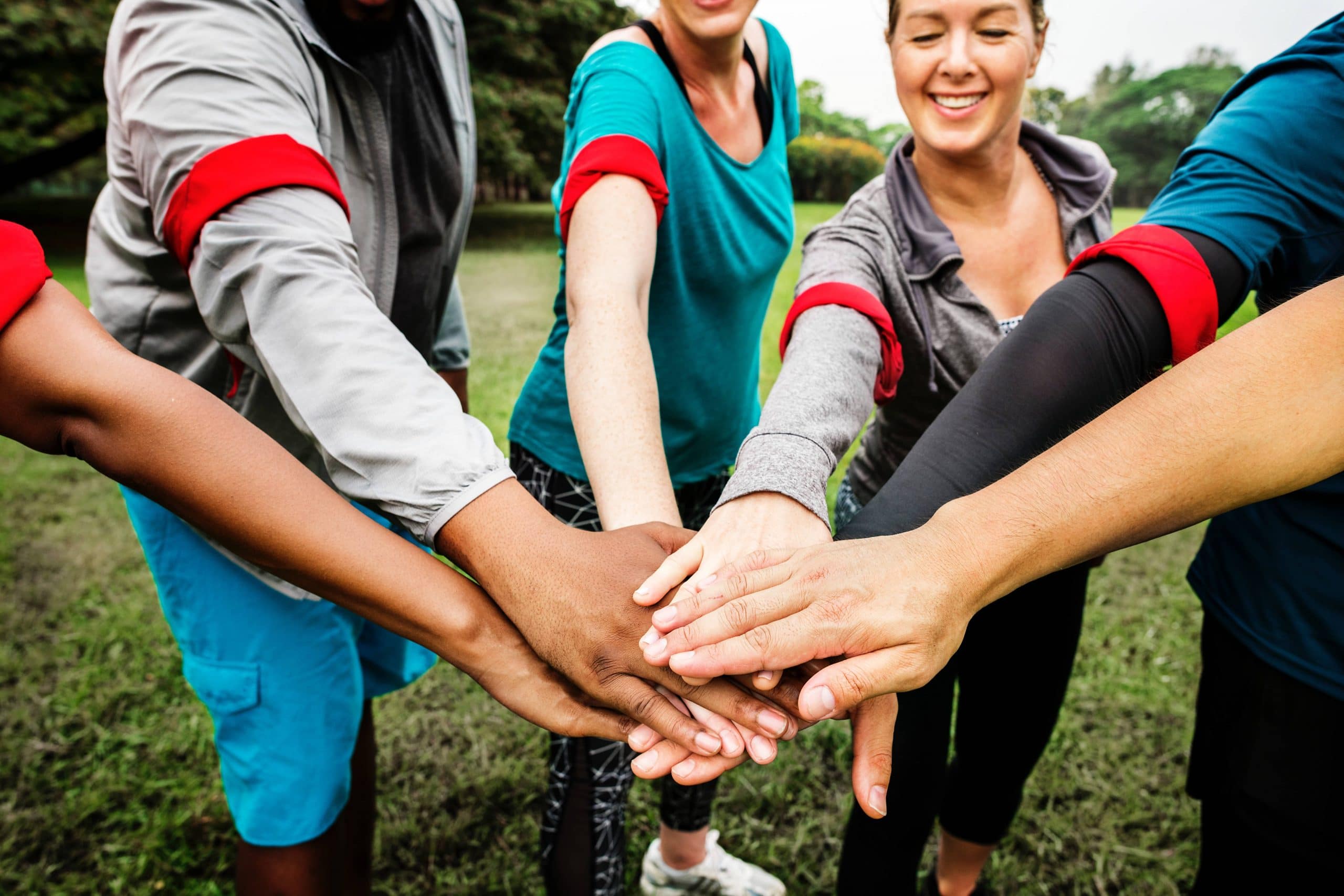 a chiropractic team having a making a group gesture about fighting back pain