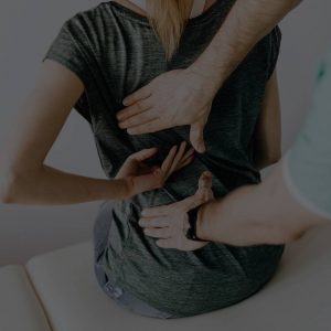 chiropractic care and adjustment on a female's back by a chiropractor