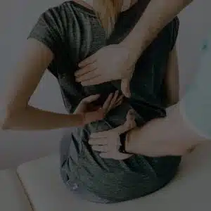 chiropractic care and adjustment on a female's back by a chiropractor