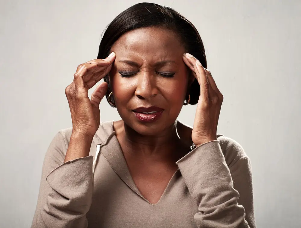 woman of color having a bad headache