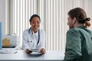 Chiropractor having a consultation with a patient