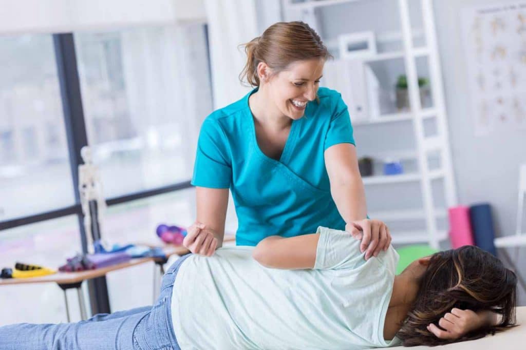 Young patient having pediatric chiropractic treatment in a clinic