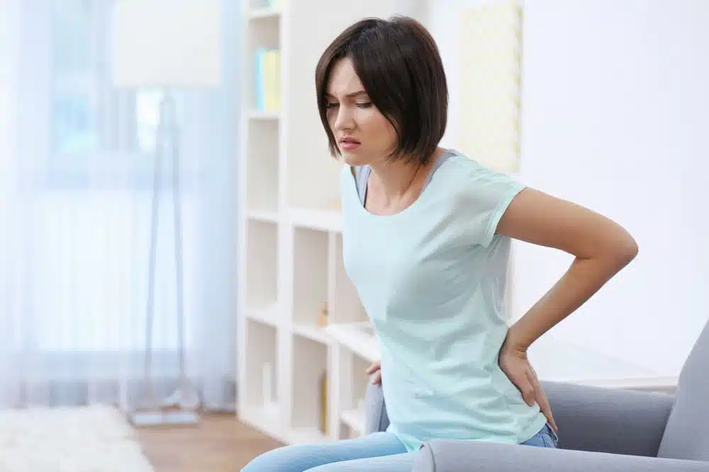 Woman feeling the widespread pain all over her body
