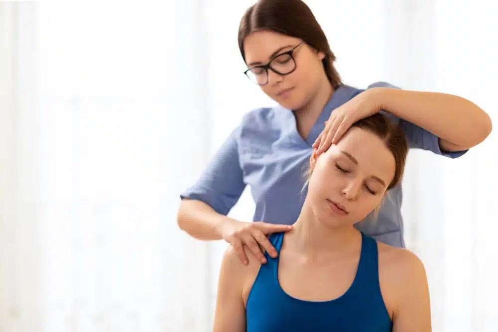 Chiropractor is doing some Active Release Technique to the patient to treat her chronic neck pain