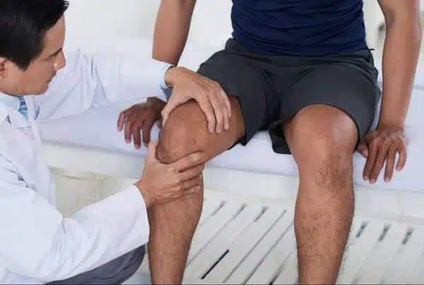 A Chiropractor is doing some knee evaluation to the patient at Woodlands, TX