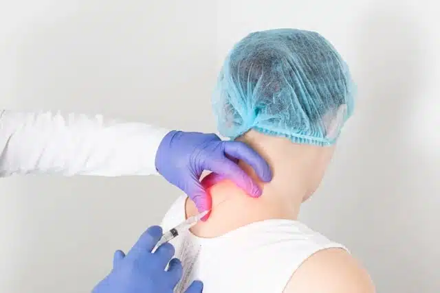 The doctor is doing some stem cell therapy to the patients neck. Regenerative medicine concept 