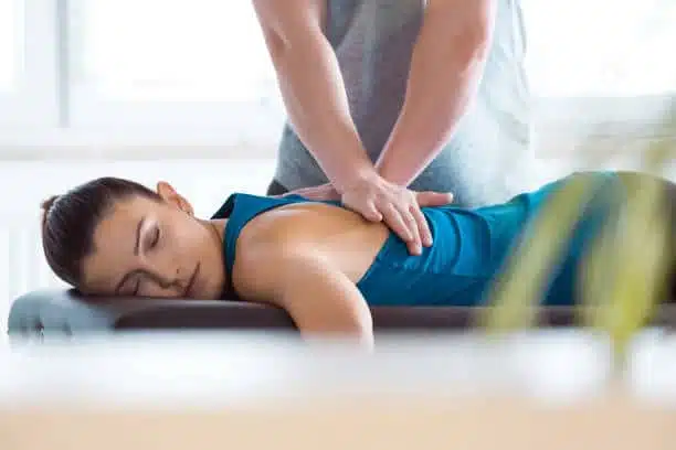 Chiropractor doing some chiropractic adjustment to the patient.