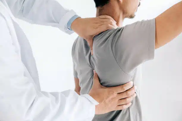 Chiropractic doing healing treatment on a patient's back.