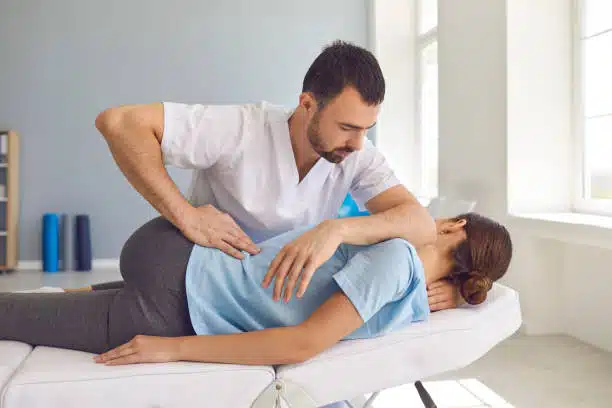 Chiropractor doing some chiropractic adjustment to the patient.