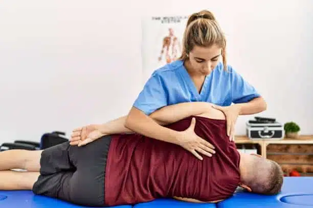 Chiropractor doing some chiropractic adjustment to the patient.