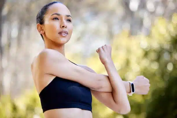 Fit and healthy young athlete doing some outdoor exercises.