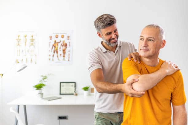 Male doctor chiropractor doing some chiropractic adjustment to the patient.