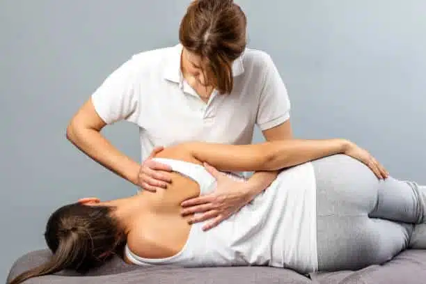 Chiropractor doing some chiropractic adjustment to the patient.