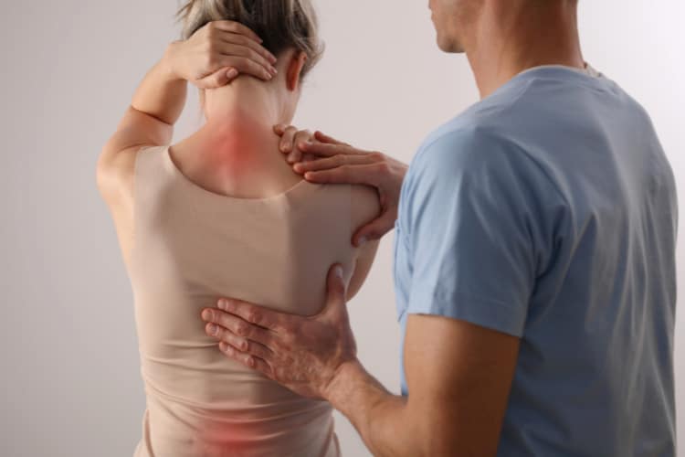 Chiropractor doing some Pain Management Therapy to the patient.