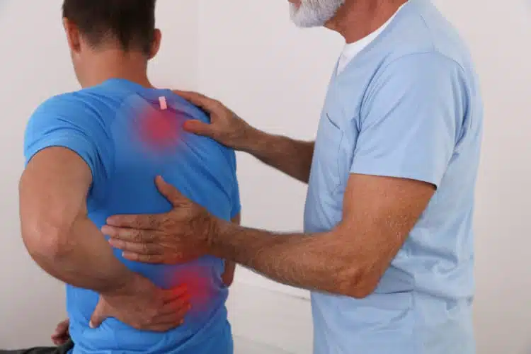 Chiropractor doing some relief pain therapy to the patient