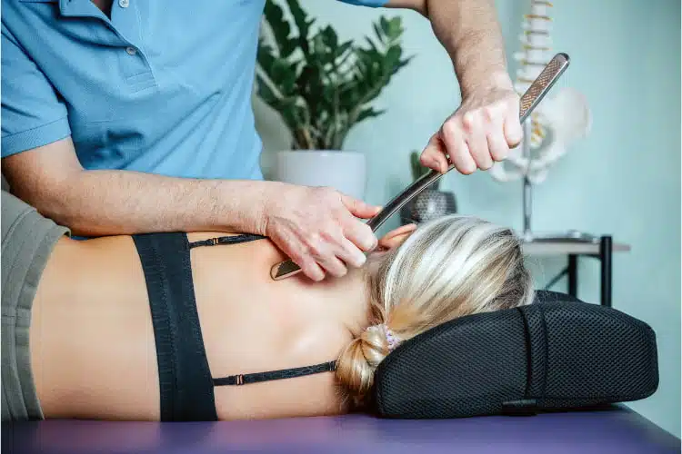 Chiropractor doing some Active Release Technique to the patient