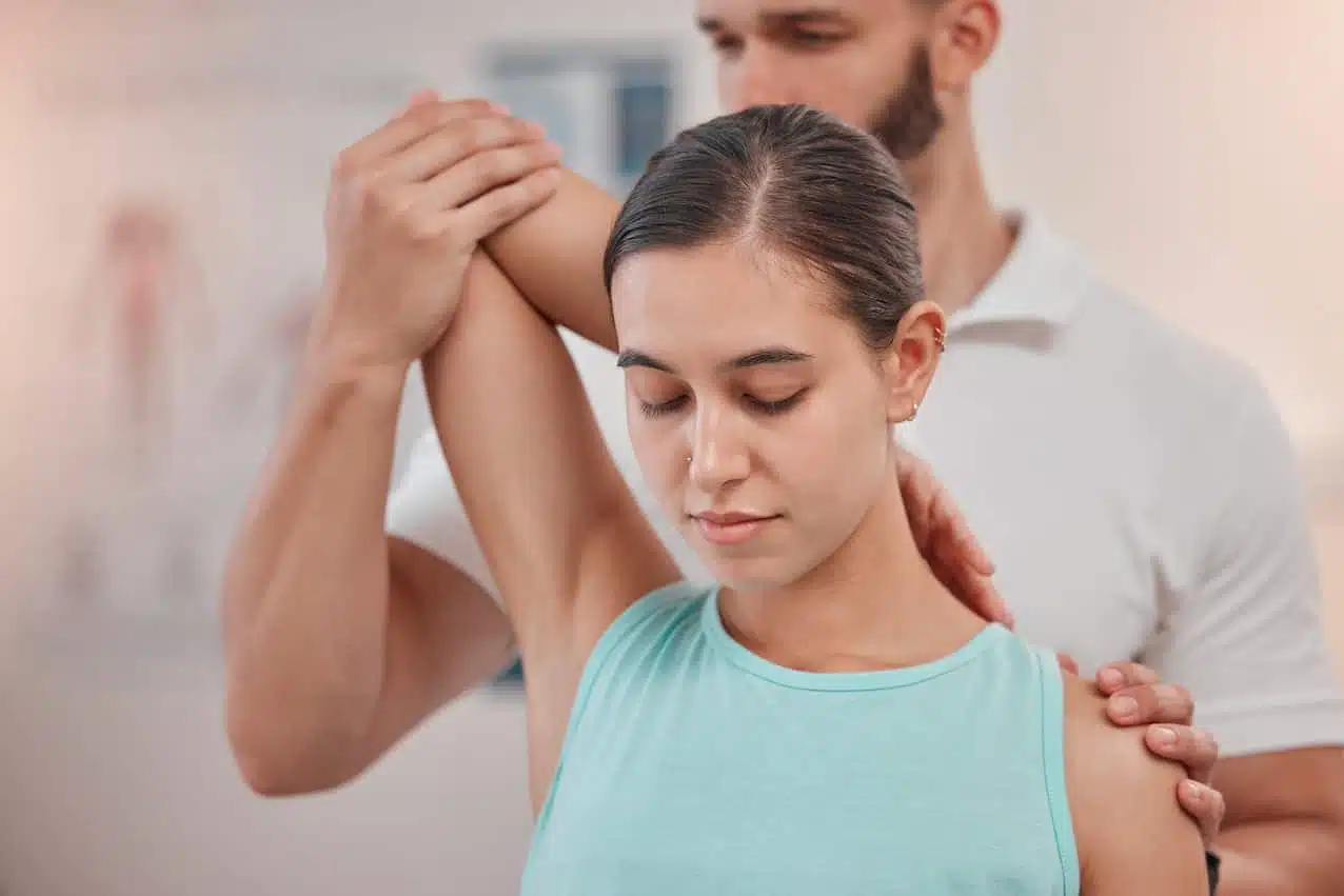 Woman under going a pain management treatment at a chiropractic clinic.