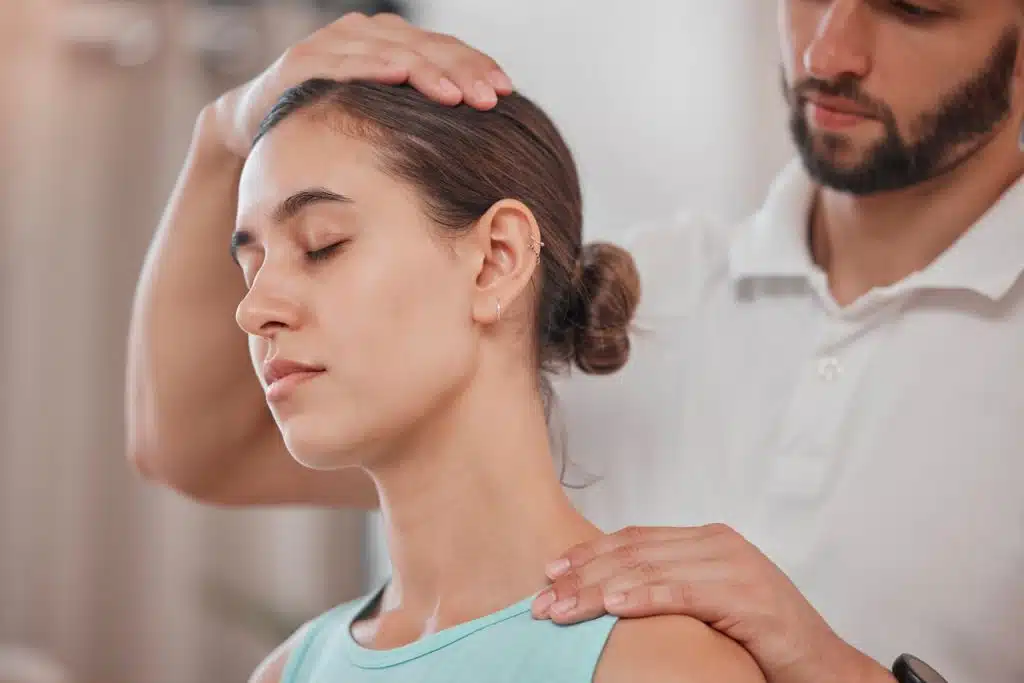 Woman under going a pain management treatment at a chiropractic clinic.