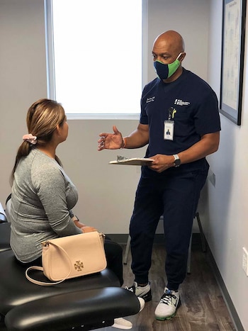 Dr. Jerry Gentry talking to his patient