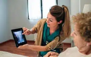 Female doctor showing xray of patient on a tablet | HSRC
