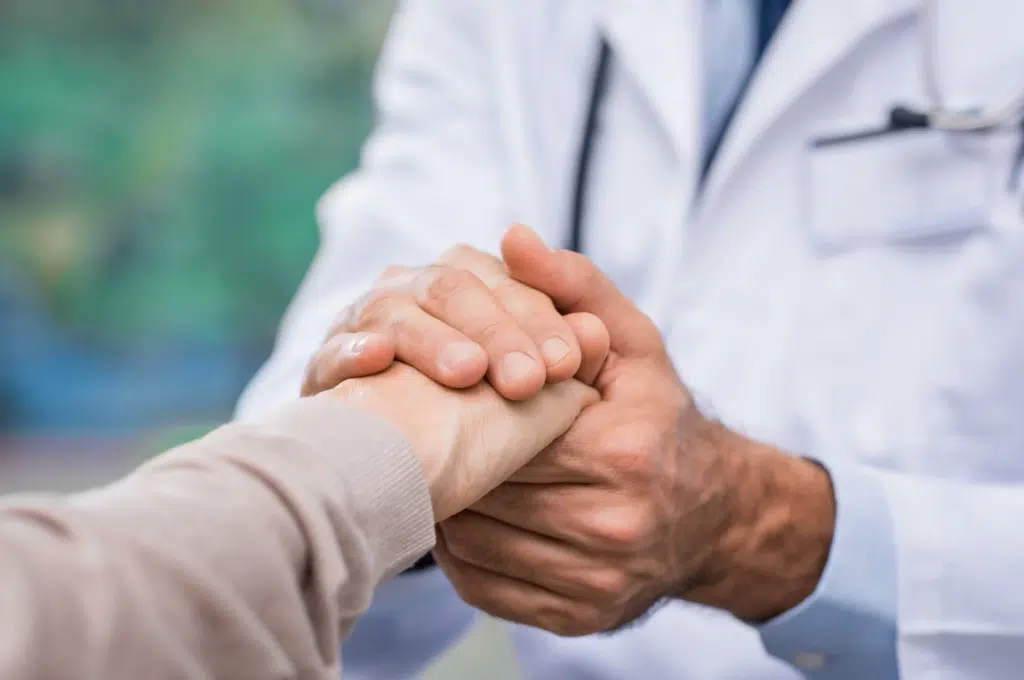 A doctor reassuring a patient