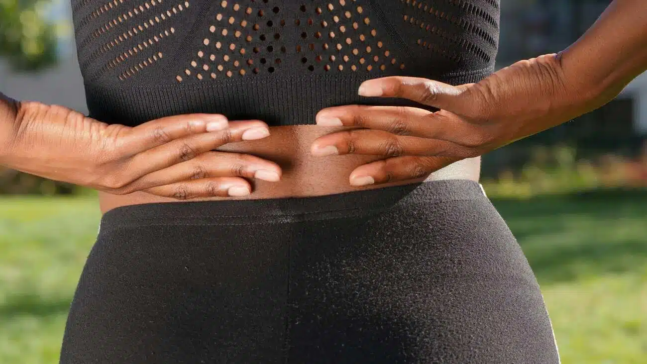 black woman having a back pain issue