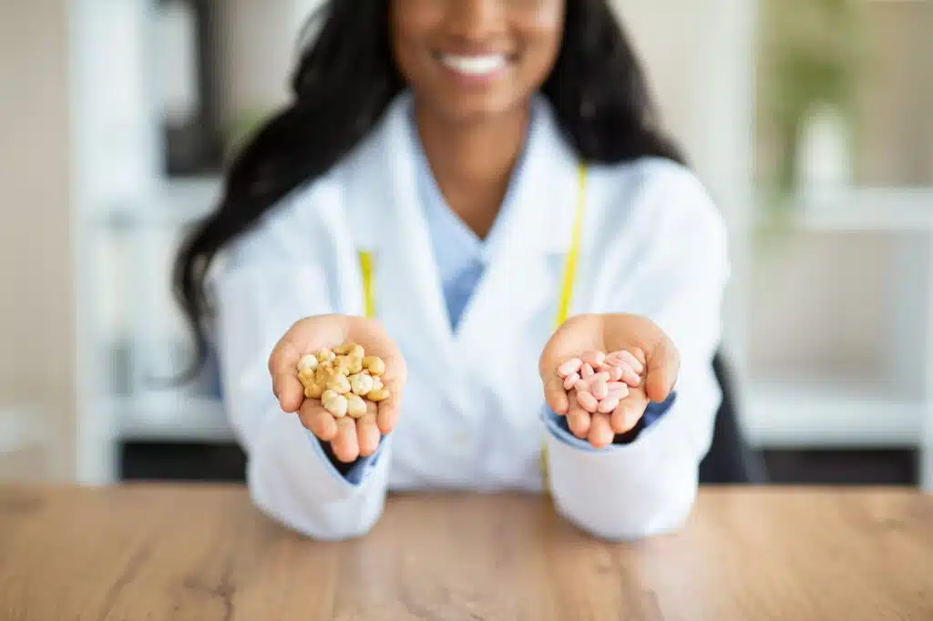 Woman holding two kinds of medication