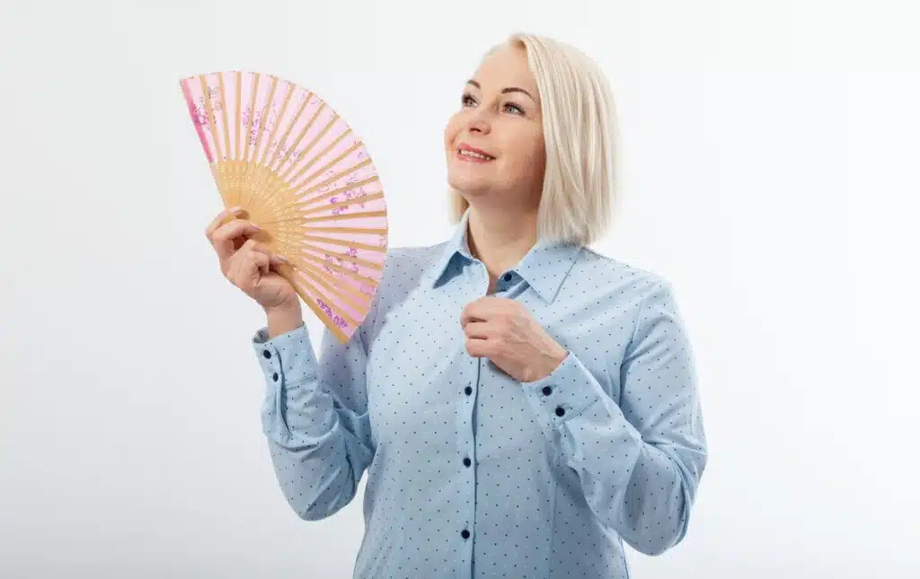 A woman having hot flashes