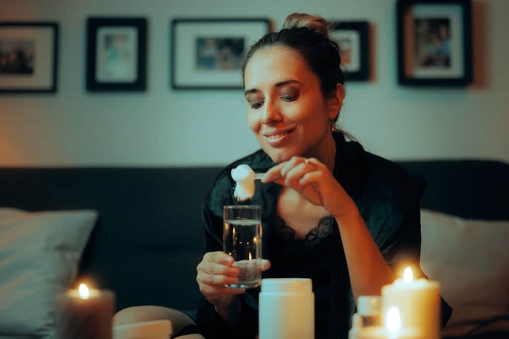 A woman mixing her peptide therapy collagen powder
