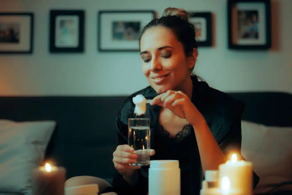 A woman mixing her peptide therapy collagen powder